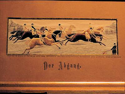 Image of horses eager to get away at the start of a race, with German words on card mount